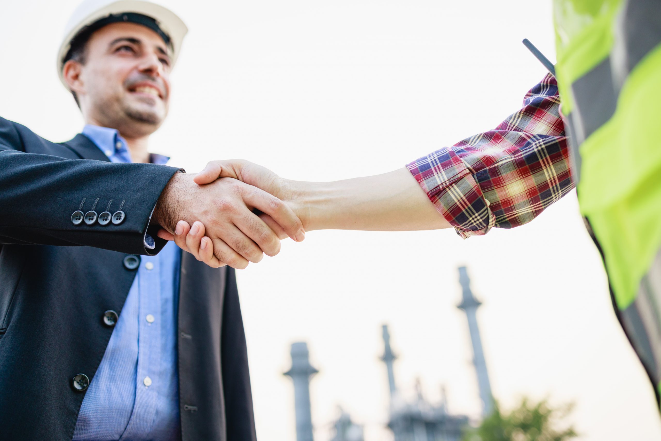 bussines-partners-handshakes-construction-and-bus-2025-01-09-05-34-06-utc